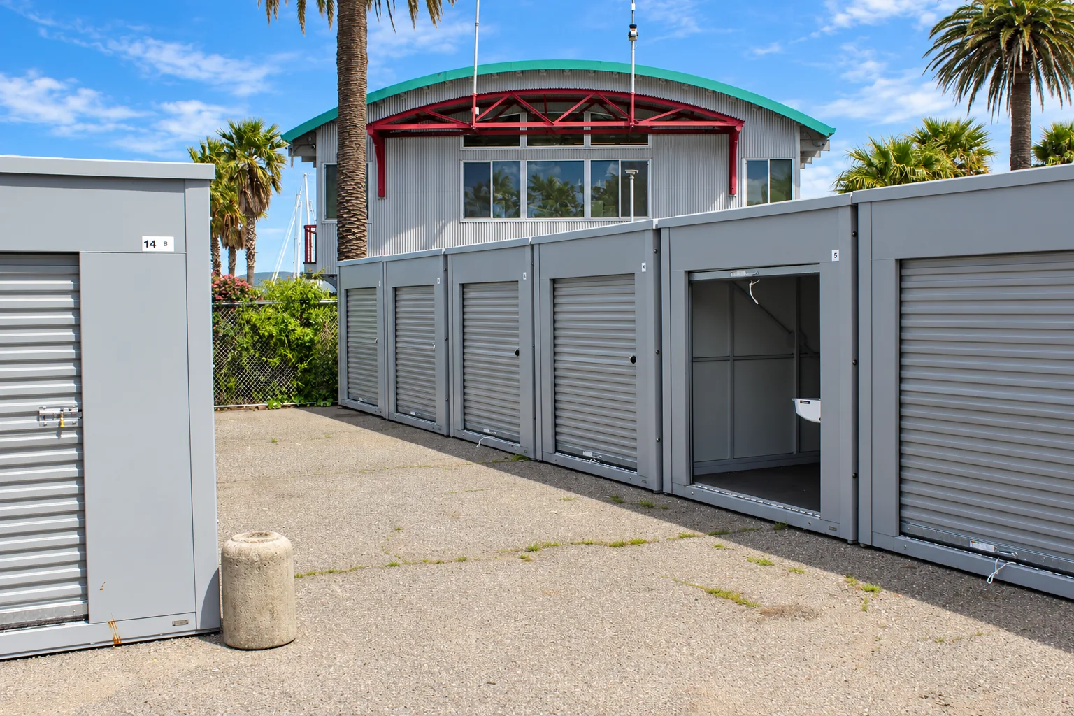 Row of roll-up storage units at Marinship Industries Storage, 70 Liberty Ship Way, Sausalito, CA
