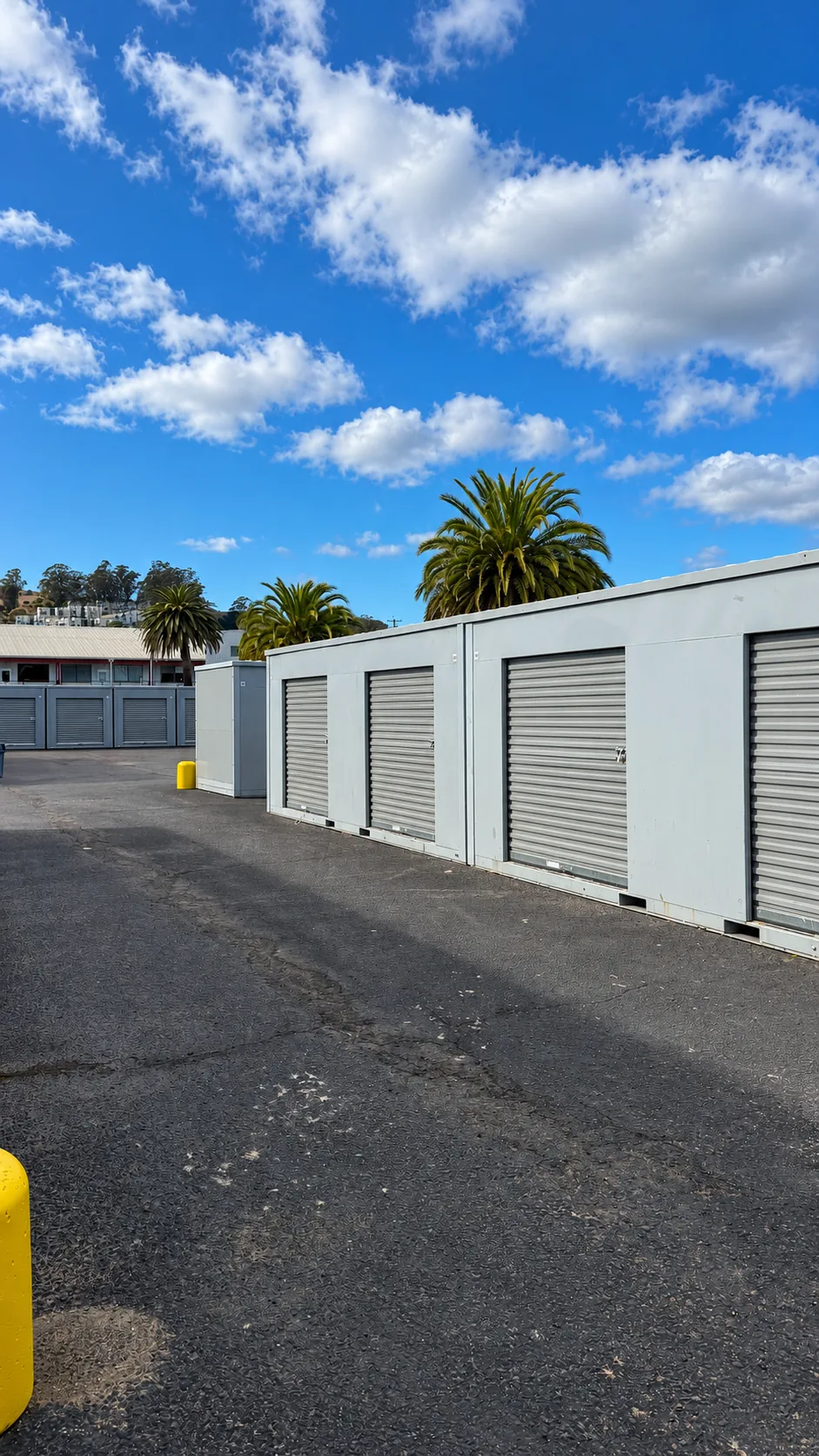 Roll-up storage units on a paved lot at Marinship Industries Storage, Sausalito